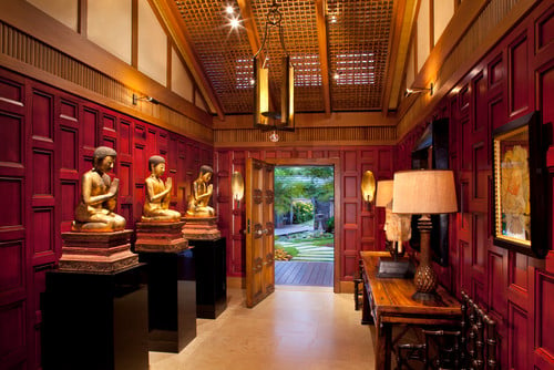 This is an Asian interior design style foyer with redwood paneled walls.