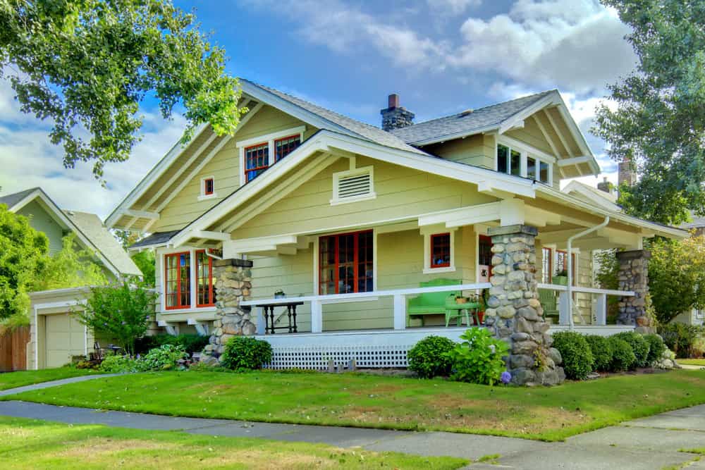 This is a yellow craftsman home exterior view.